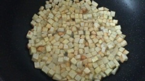 Frying the yam cubes