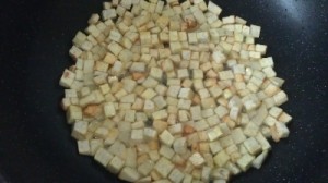 Frying the yam cubes