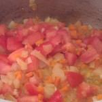 Sautee onions, carrots, tomatoes and garlic